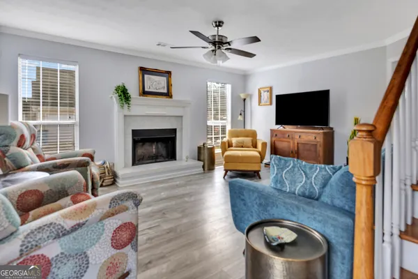 a living room with furniture and a fireplace