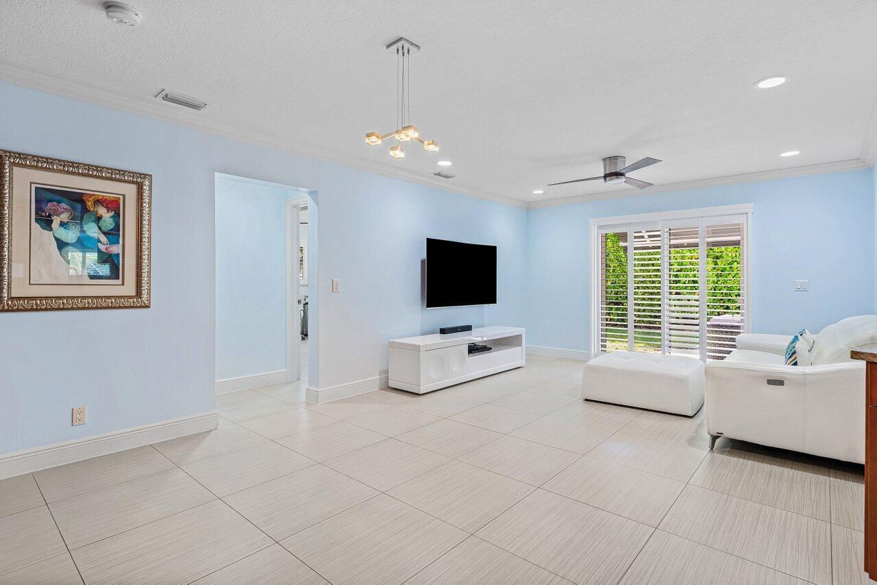 701 Buoy Road North Palm Beach, FL 33408 - Photo 33 of 52 a living room with furniture and a flat screen tv