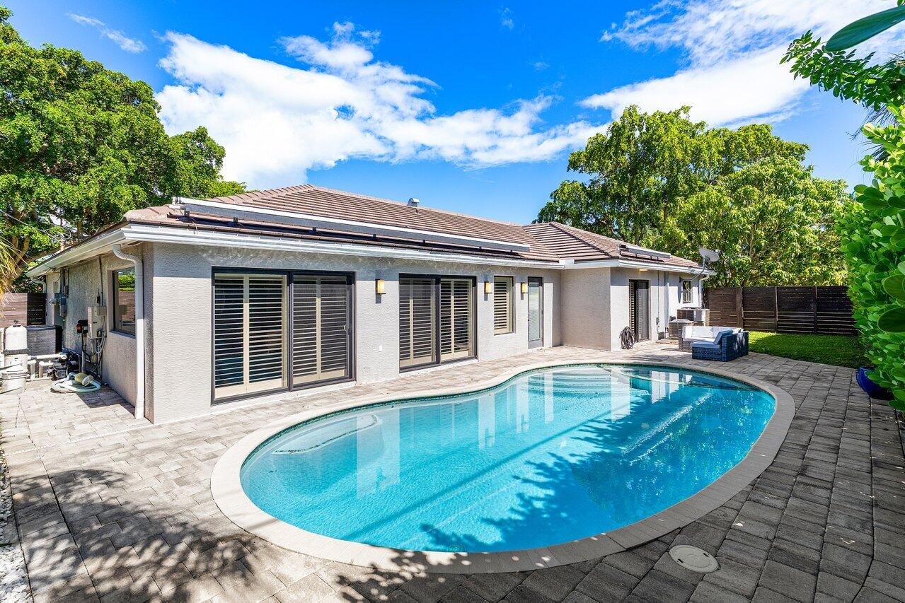 701 Buoy Road North Palm Beach, FL 33408 - Photo 35 of 52 a view of a house with swimming pool and sitting area