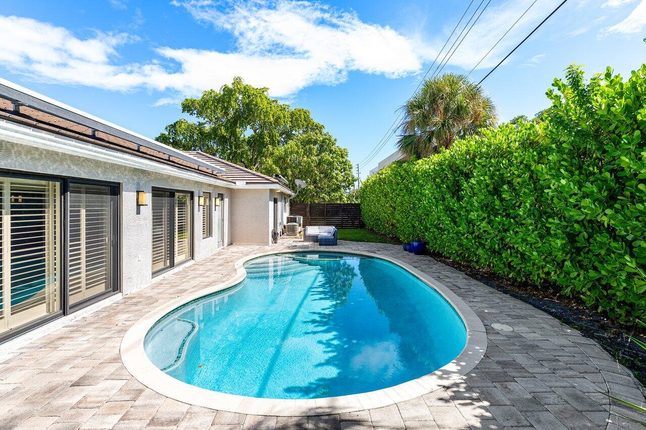 701 Buoy Road North Palm Beach, FL 33408 - Photo 36 of 52 a view of a house with pool