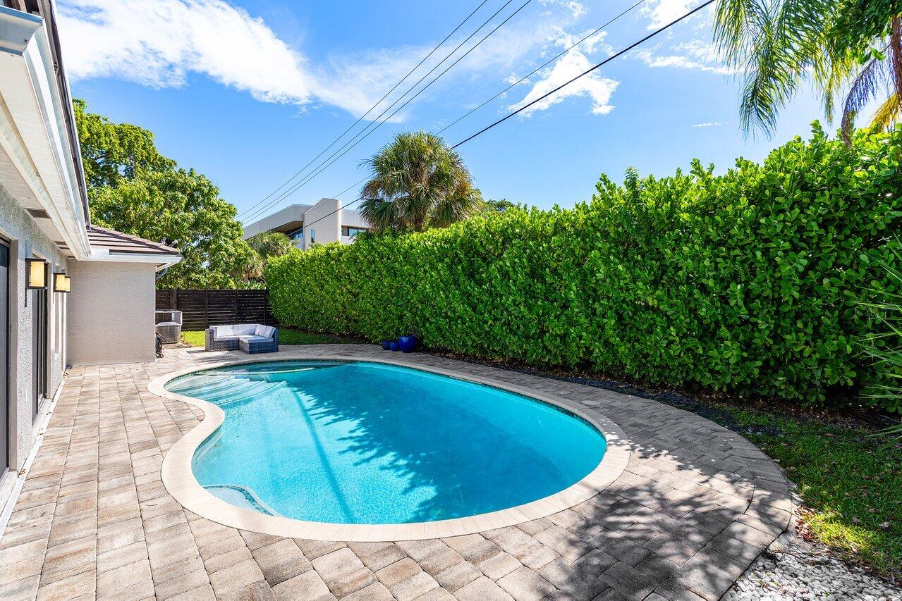 701 Buoy Road North Palm Beach, FL 33408 - Photo 37 of 52 a view of a swimming pool with an outdoor space