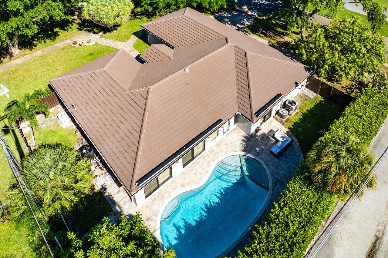 701 Buoy Road North Palm Beach, FL 33408 - Photo 45 of 52 a view of a house with a yard and potted plants