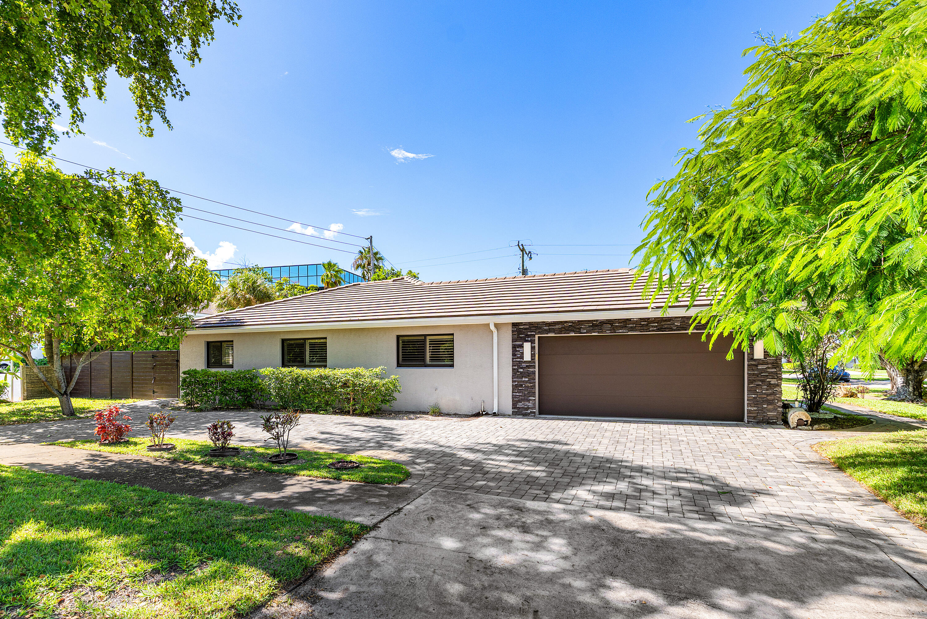 701 Buoy Road North Palm Beach, FL 33408 - Photo 5 of 52 a front view of a house with a garden
