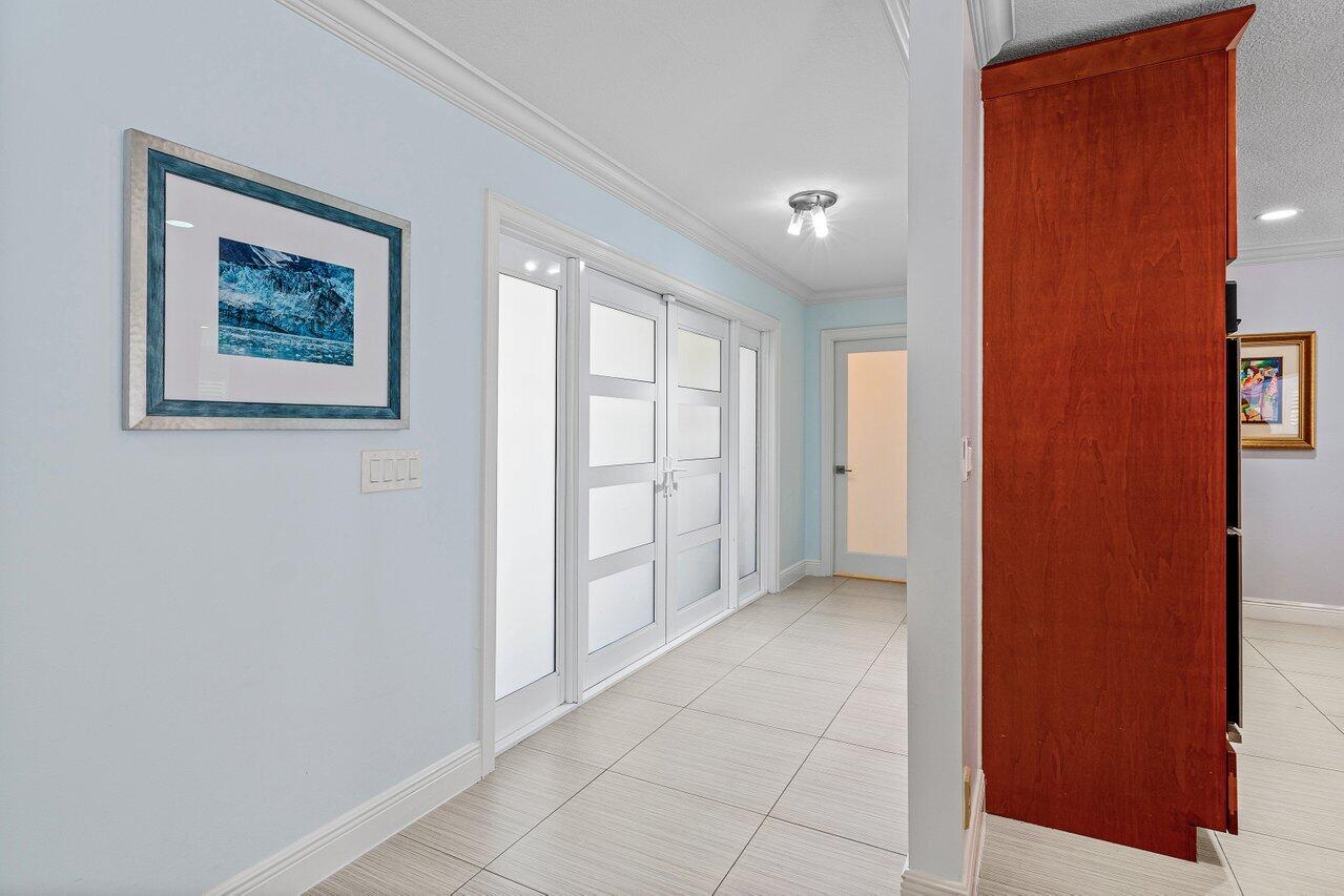 701 Buoy Road North Palm Beach, FL 33408 - Photo 6 of 52 an empty room with entrance and windows