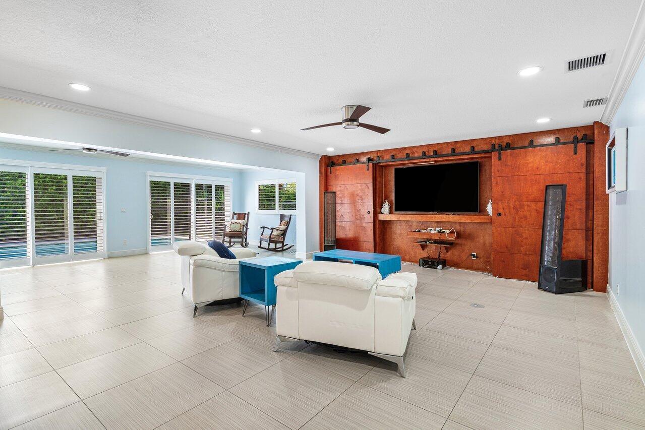 701 Buoy Road North Palm Beach, FL 33408 - Photo 7 of 52 a living room with furniture and a flat screen tv