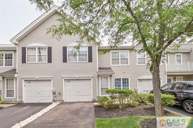 front view of a house with a garden
