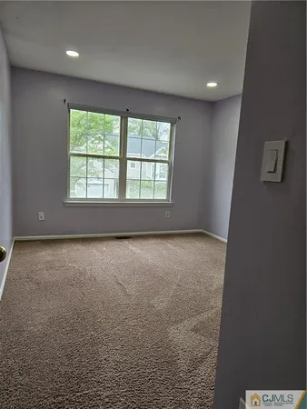 an empty room with a empty space and windows