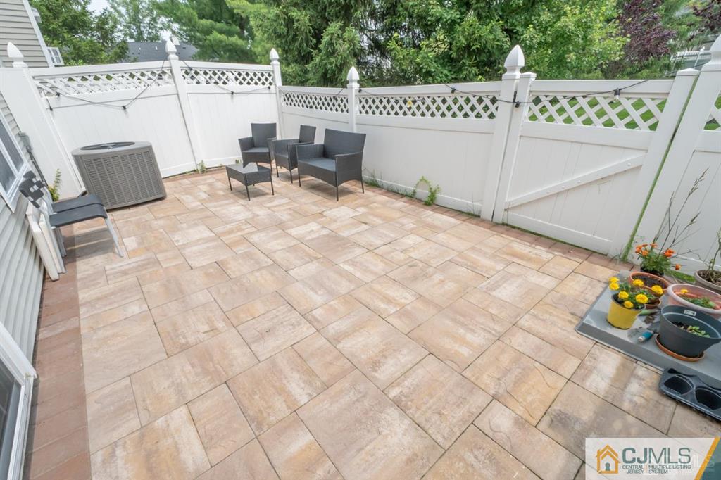2403 Pheasant Run Monmouth Junction, NJ 08852 - Photo 26 of 36 a view of a patio with table and chairs