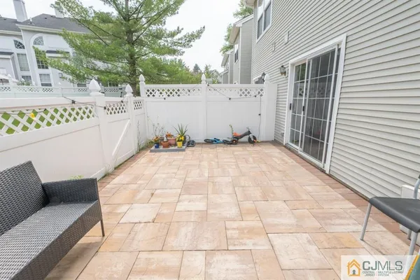 a view of a terrace with white walls