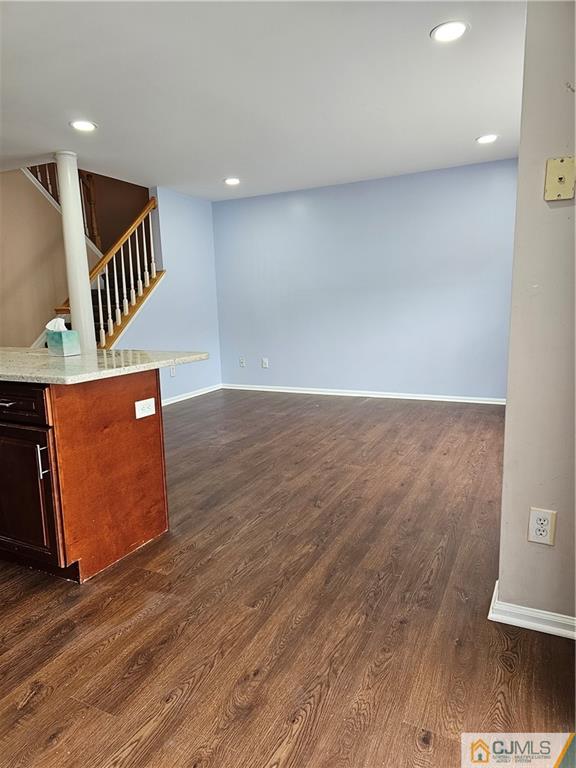 2403 Pheasant Run Monmouth Junction, NJ 08852 - Photo 6 of 36 an empty room with wooden floor and windows