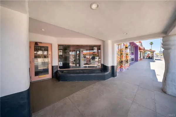 a living room with furniture and large window