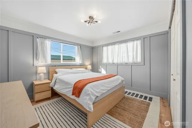 a bedroom with a bed and window