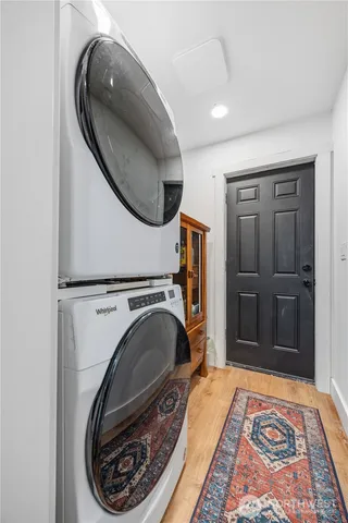 a view of a bedroom with washer and dryer