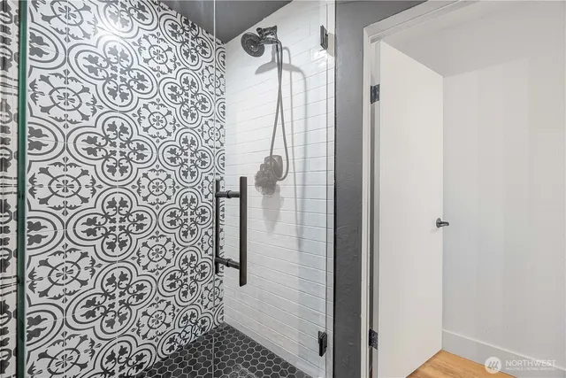 a bathroom with a shower and a shower curtain