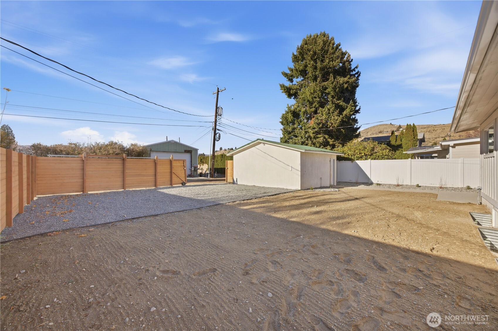 409 North Cedar Street Chelan, WA 98816 - Photo 27 of 33 a front view of a house with a yard and garage