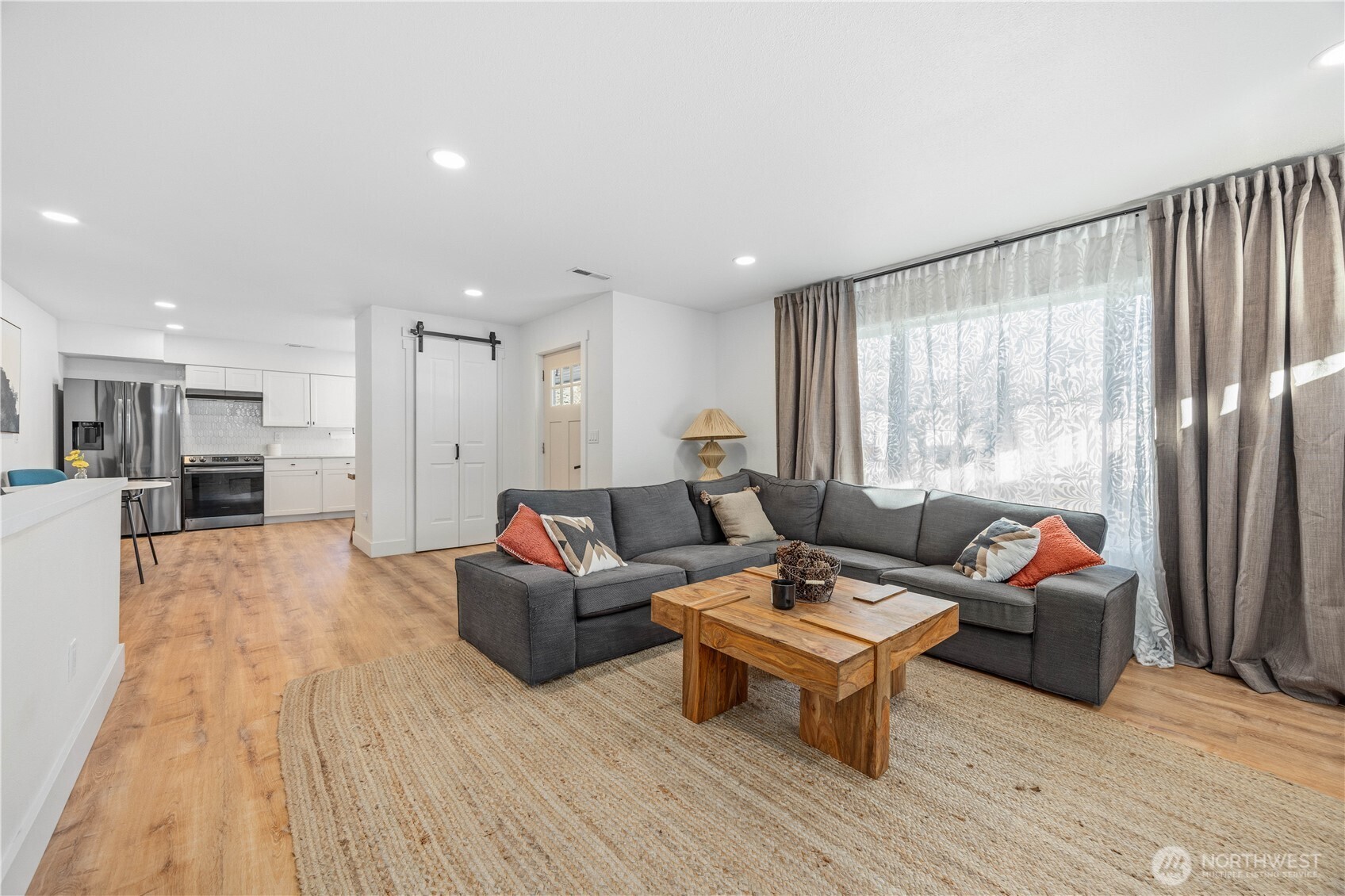 409 North Cedar Street Chelan, WA 98816 - Photo 4 of 33 a living room with furniture and a large window