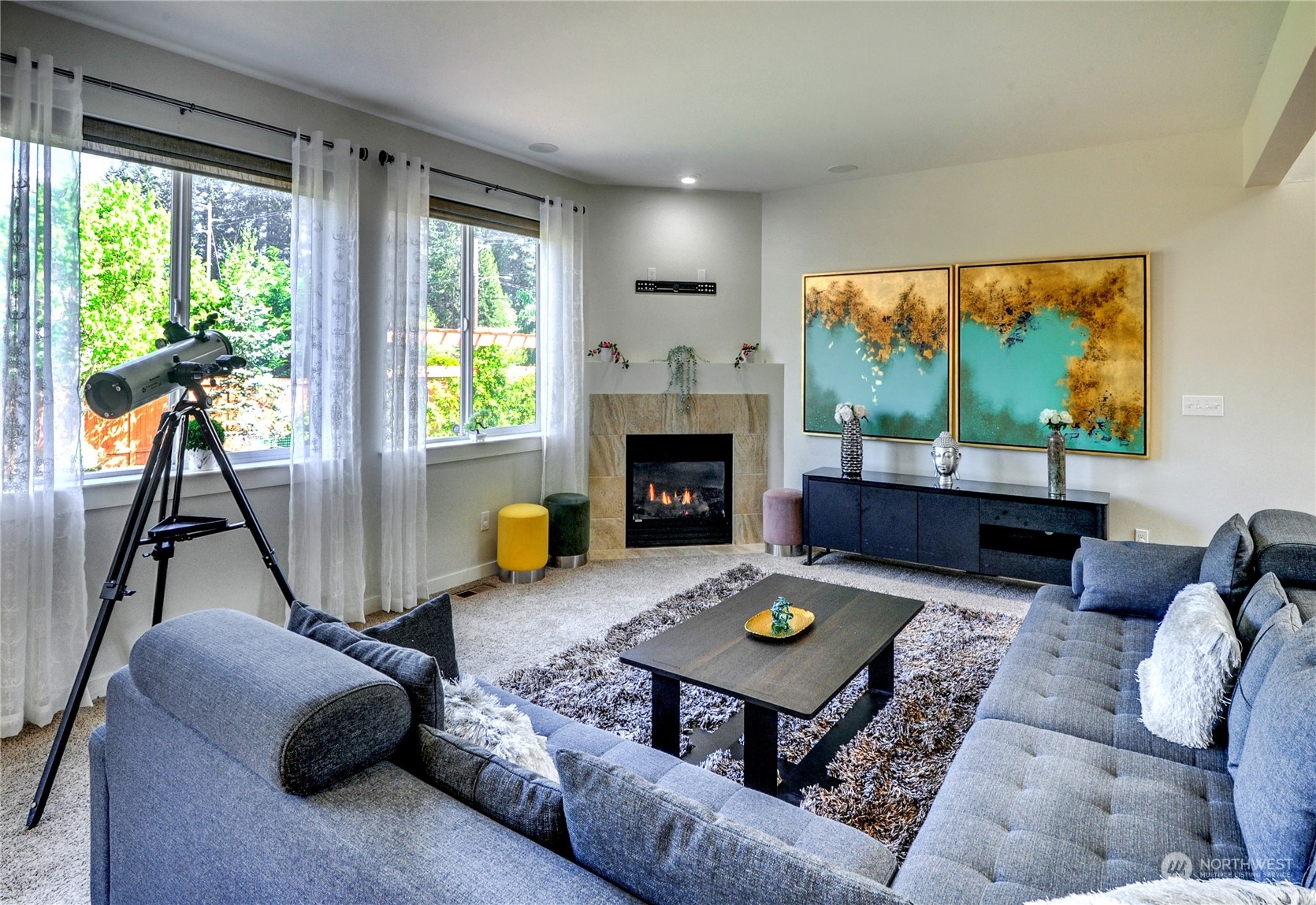 829 218th Street Southeast Bothell, WA 98021 - Photo 14 of 40 a living room with furniture a fireplace and a large window