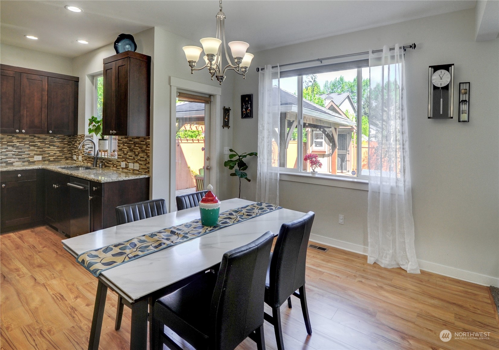 829 218th Street Southeast Bothell, WA 98021 - Photo 23 of 40 a view of a dining room with furniture window and wooden floor