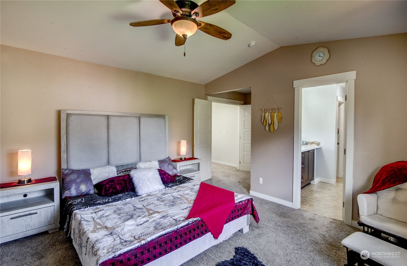 829 218th Street Southeast Bothell, WA 98021 - Photo 27 of 40 a bedroom with a bed and a chandelier