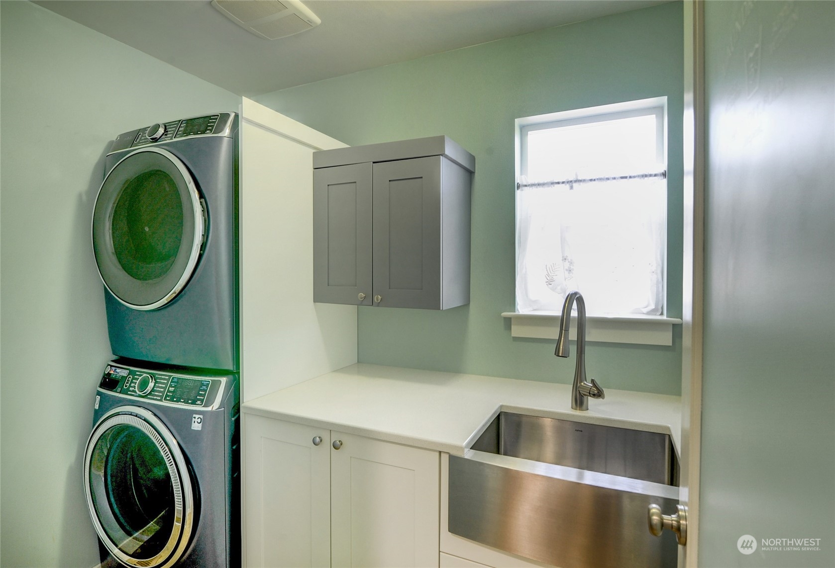 829 218th Street Southeast Bothell, WA 98021 - Photo 31 of 40 a kitchen with a sink and a washer dryer