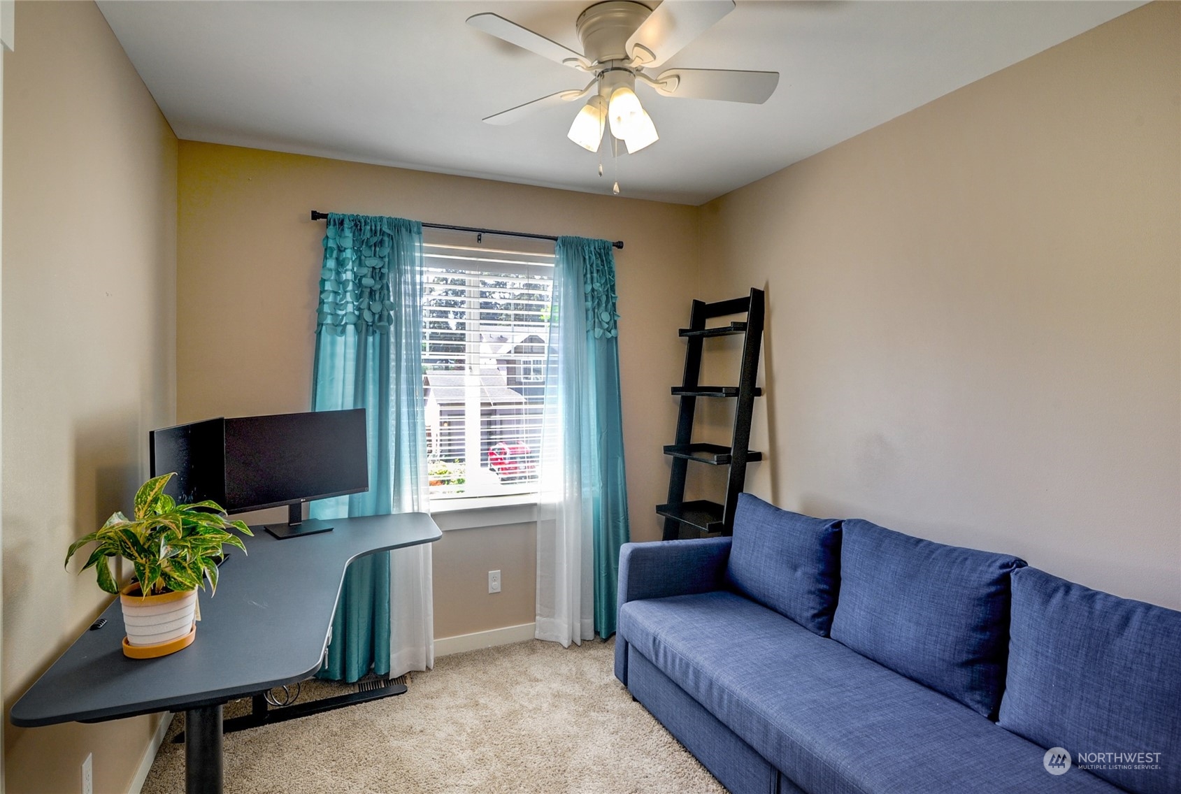 829 218th Street Southeast Bothell, WA 98021 - Photo 33 of 40 a living room with furniture and a potted plant