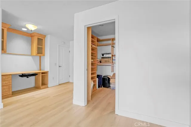 a bathroom with a granite countertop sink and a bathtub