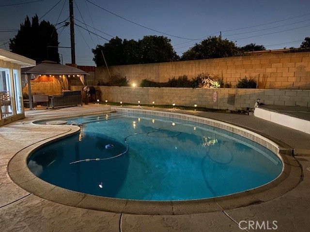 11503 Tropico Avenue Whittier, CA 90604 - Photo 4 of 5 a view of a swimming pool with an outdoor space and seating area