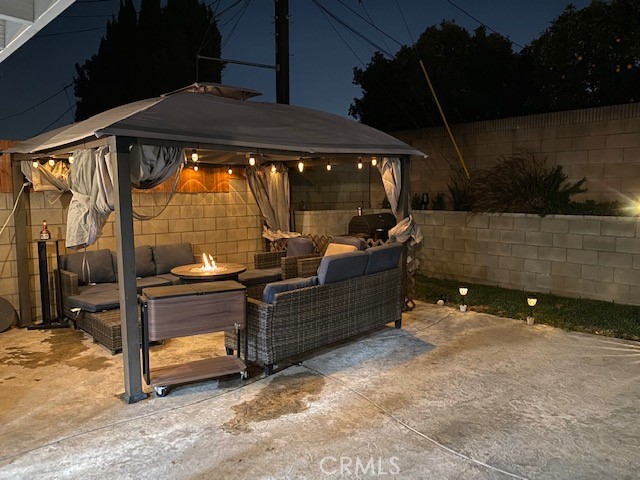 11503 Tropico Avenue Whittier, CA 90604 - Photo 5 of 5 an outdoor sitting area with furniture and umbrella