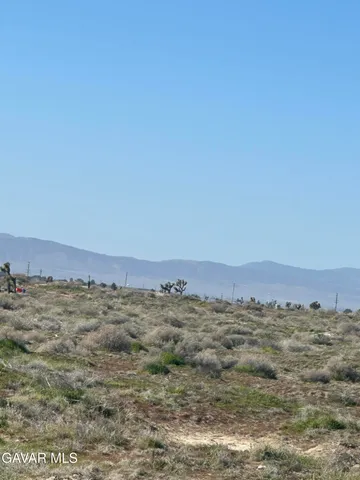 a view of ocean and mountain