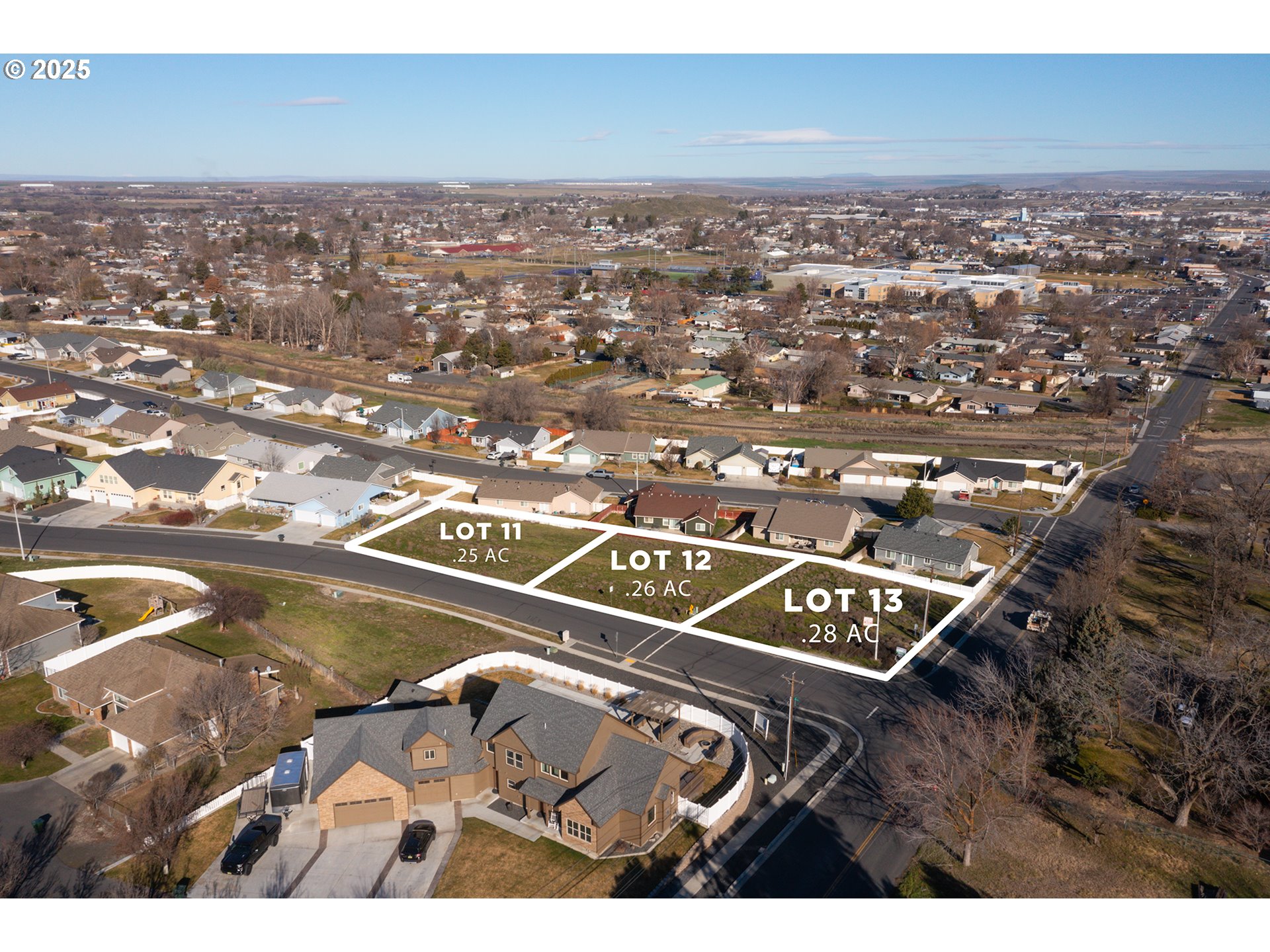 106 Southwest Desert Sky Drive, Unit 12 Hermiston, OR 97838 - Photo 3 of 6 an aerial view of residential houses with outdoor space