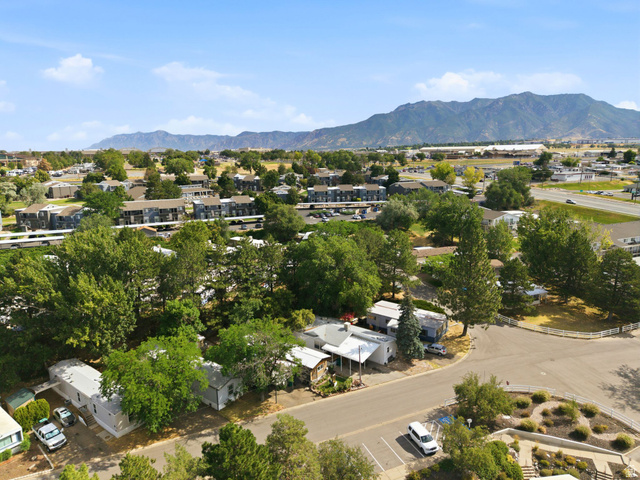 2875 North Hill Field Road, Unit 62 Layton, UT 84041 - Photo 34 of 34 Expansive aerial view showcasing residential properties, surrounding green spaces, and distant mountain ranges