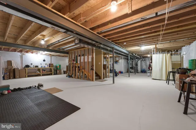 a view of the empty room with wooden floor