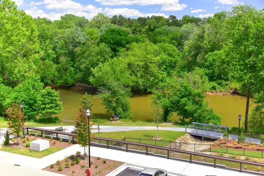 6255 Riverview Road Southeast, Unit A4 Smyrna, GA 30126 - Photo 17 of 17 a view of a swimming pool and a yard