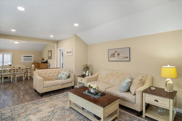 a kitchen with kitchen island a sink stove and cabinets