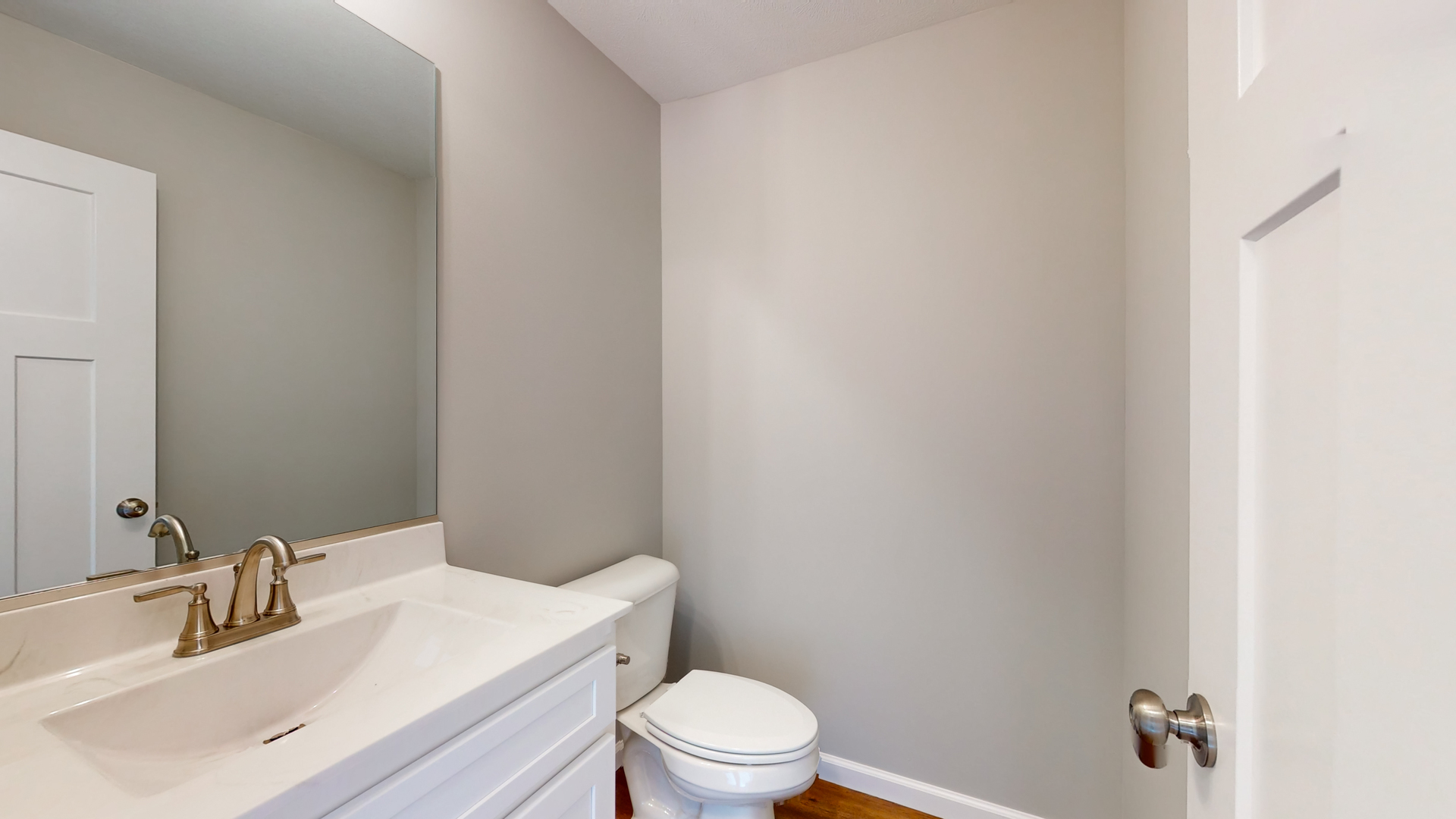 2 Megan Court Bloomington, IL 61705 - Photo 15 of 27 a bathroom with a sink a toilet and a mirror