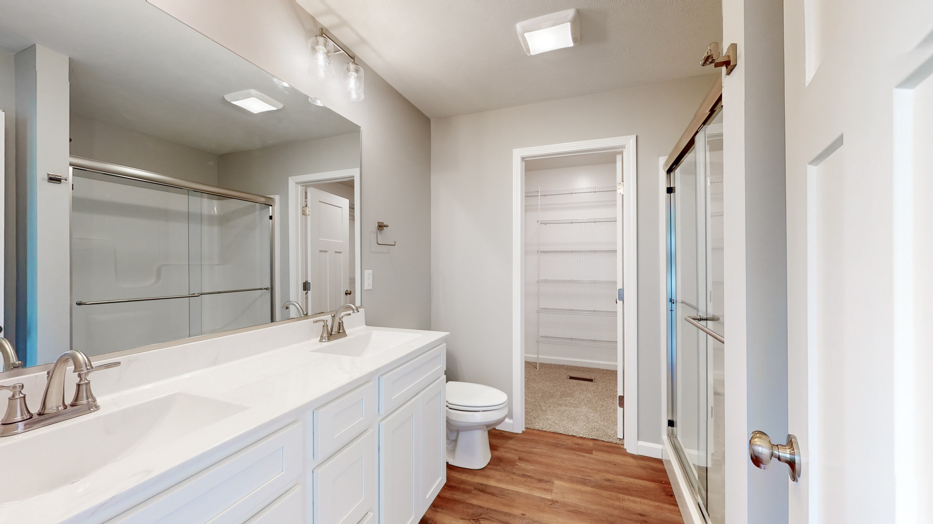 2 Megan Court Bloomington, IL 61705 - Photo 17 of 27 a bathroom with a sink a toilet and shower