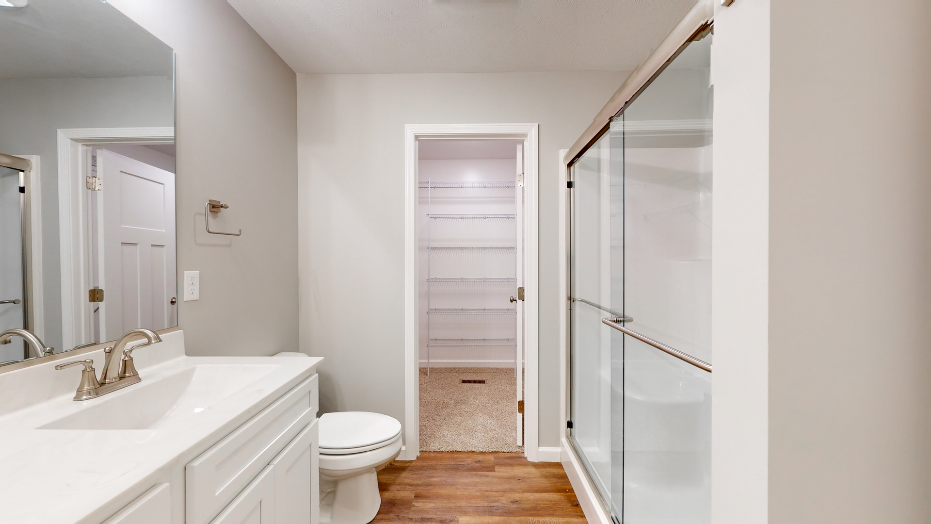2 Megan Court Bloomington, IL 61705 - Photo 18 of 27 a bathroom with a sink a toilet and shower