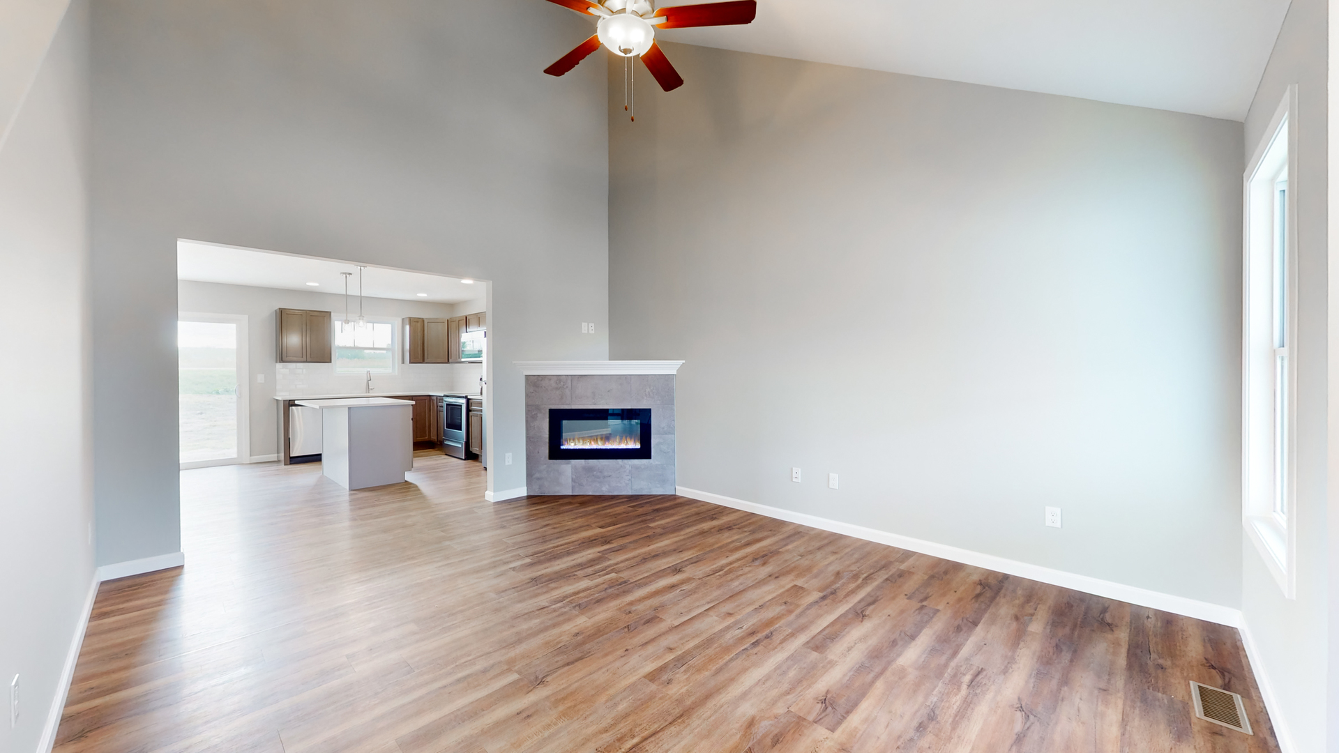 2 Megan Court Bloomington, IL 61705 - Photo 3 of 27 a view of empty room with wooden floor and fireplace