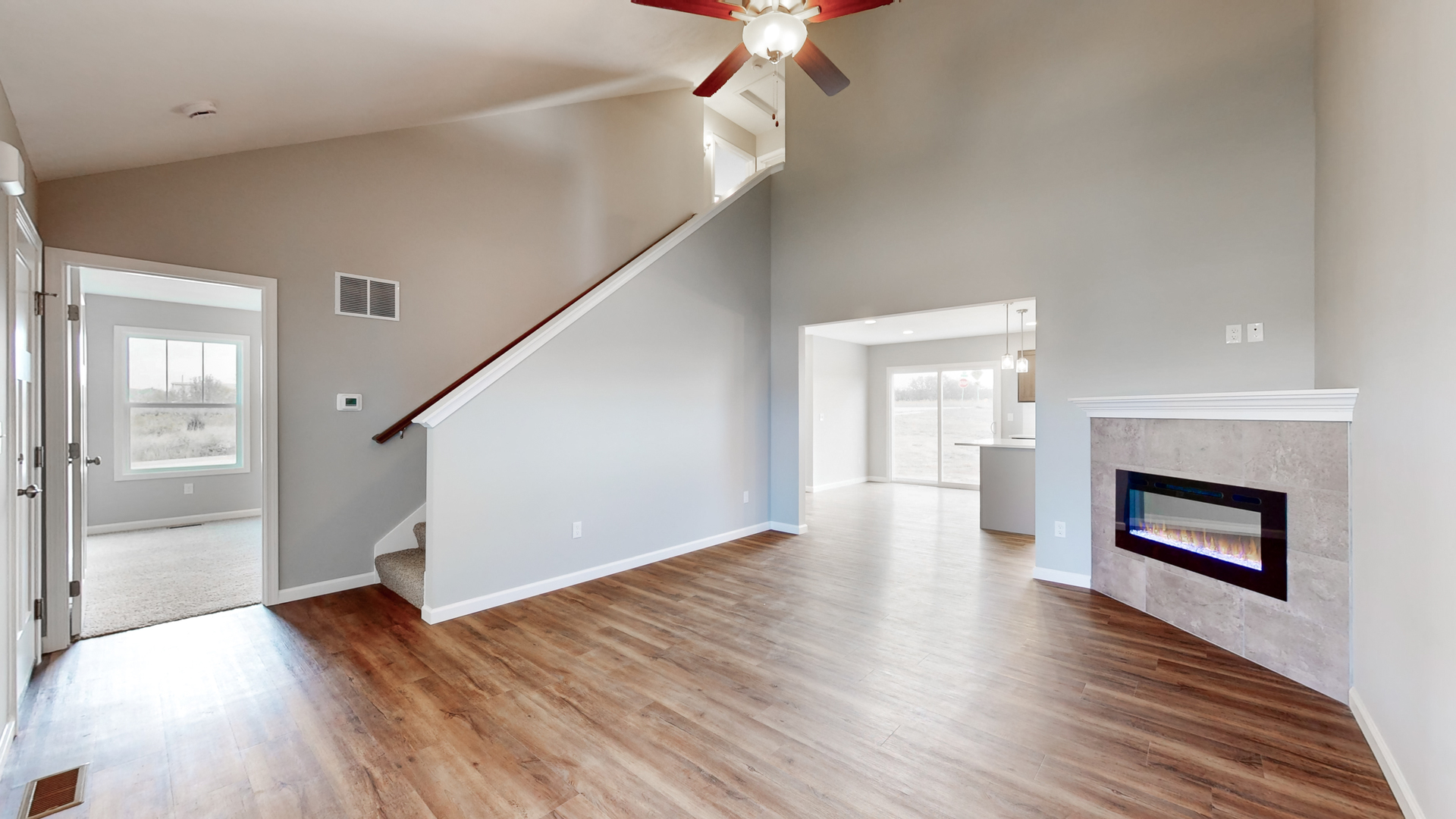 2 Megan Court Bloomington, IL 61705 - Photo 4 of 27 a view of a hallway with wooden floor fireplace and a window