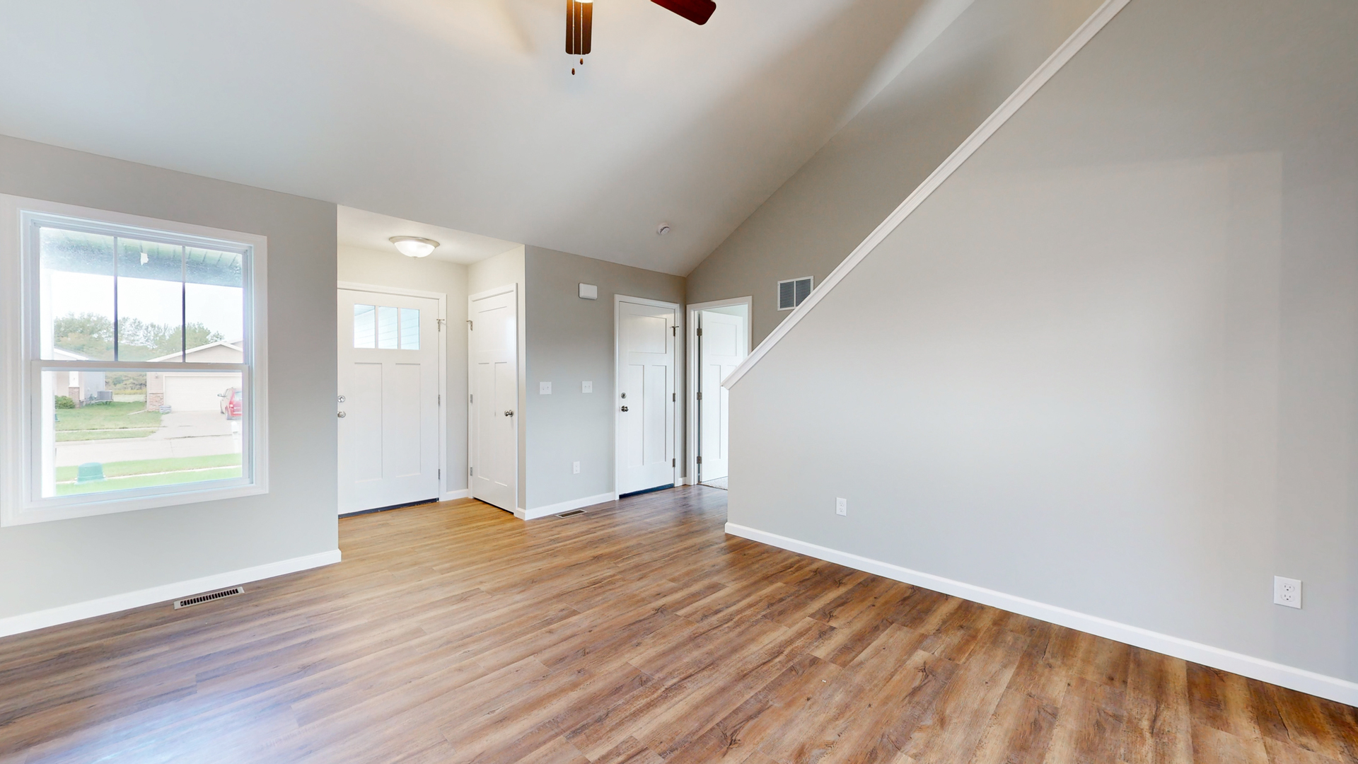 2 Megan Court Bloomington, IL 61705 - Photo 5 of 27 an empty room with wooden floor and windows