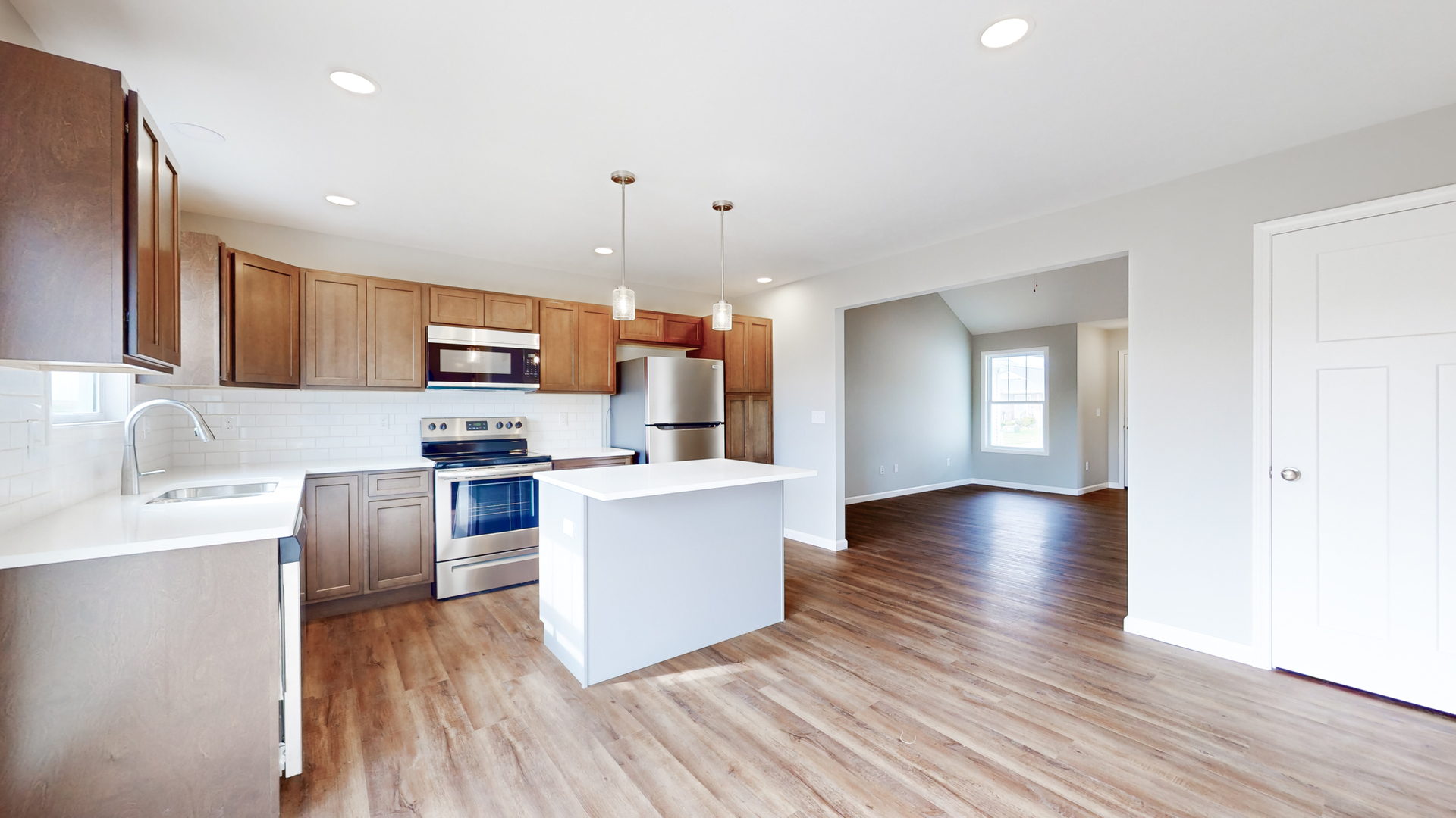 2 Megan Court Bloomington, IL 61705 - Photo 8 of 27 a kitchen with granite countertop a sink cabinets and wooden floor