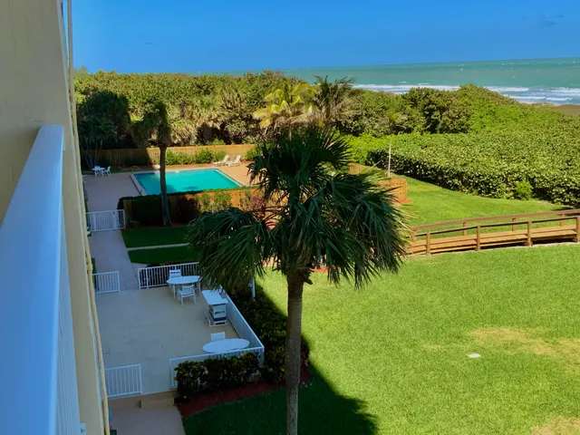 a view of a yard with furniture