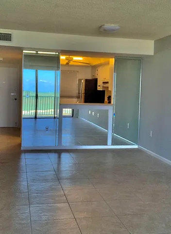 a view of livingroom with floor to ceiling window and wooden floor