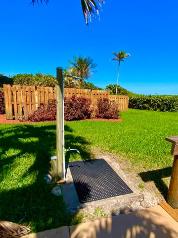 a view of a swimming pool with an outdoor seating