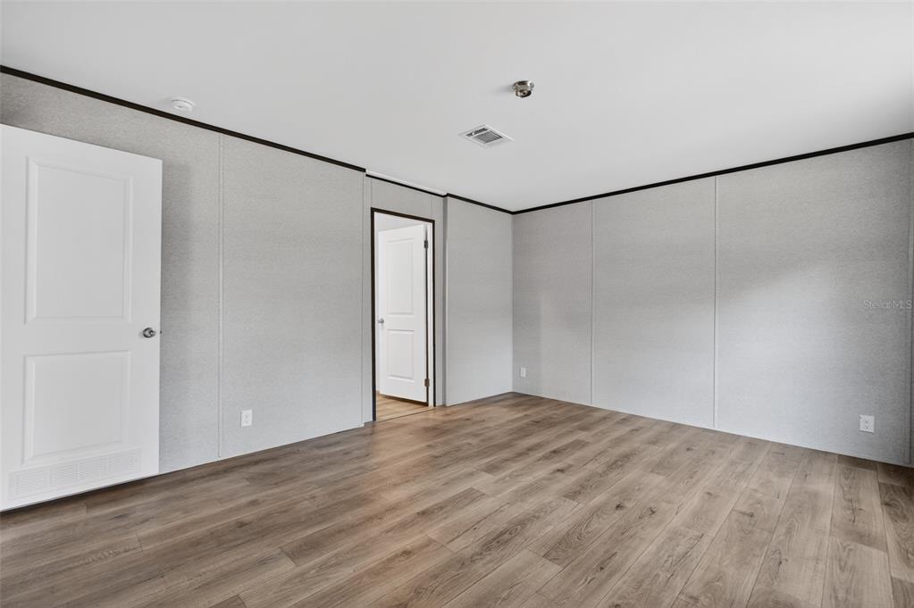 419 Lily Trail Interlachen, FL 32148 - Photo 13 of 82 a view of a room with wooden floor