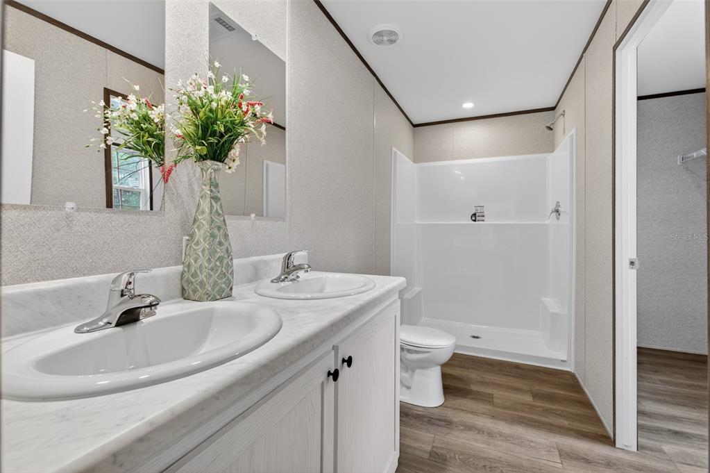 419 Lily Trail Interlachen, FL 32148 - Photo 16 of 82 a bathroom with a sink toilet and shower