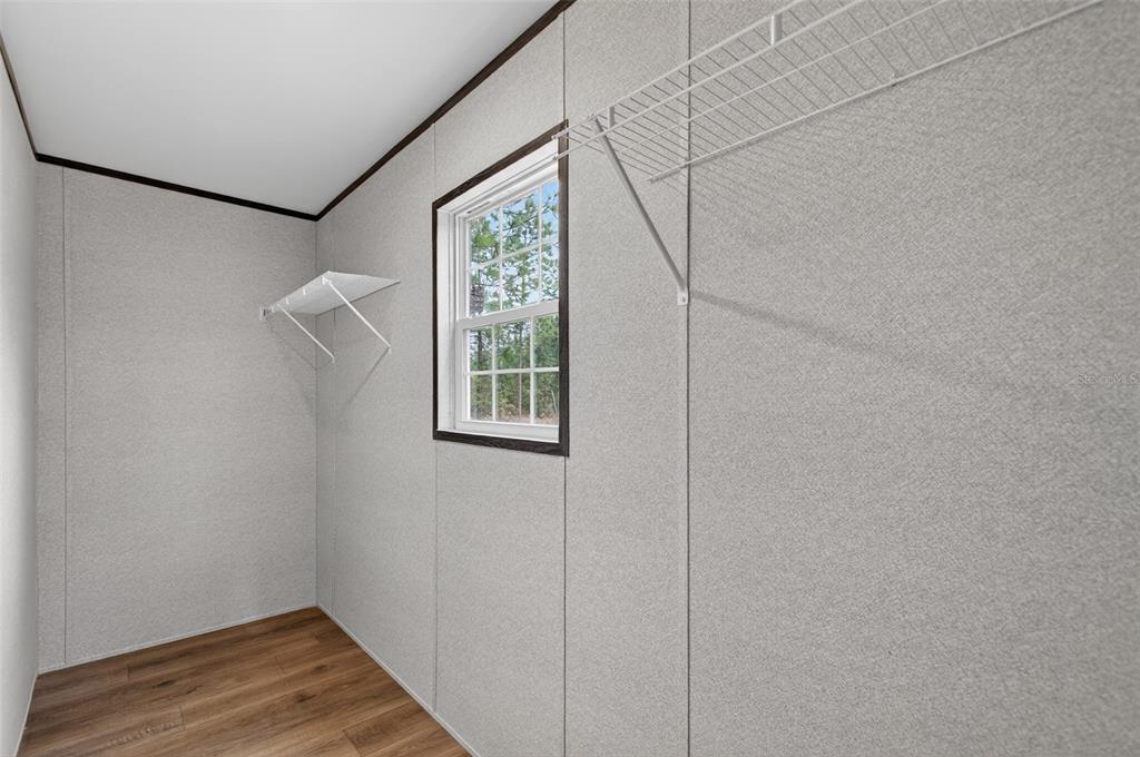 419 Lily Trail Interlachen, FL 32148 - Photo 19 of 82 a view of room with window and hardwood floor