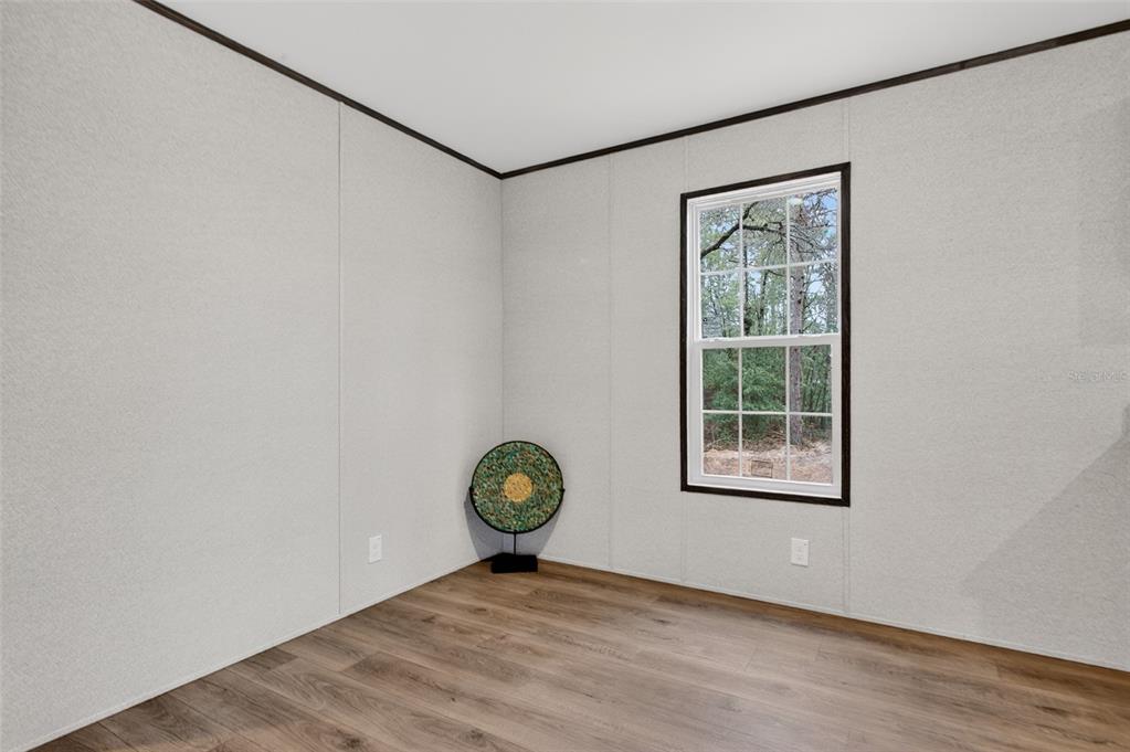 419 Lily Trail Interlachen, FL 32148 - Photo 22 of 78 an empty room with a window