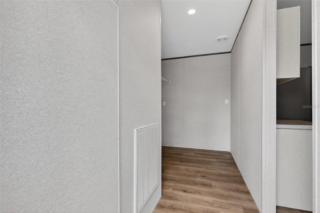 419 Lily Trail Interlachen, FL 32148 - Photo 22 of 82 a view of a hallway with wooden floor and staircase