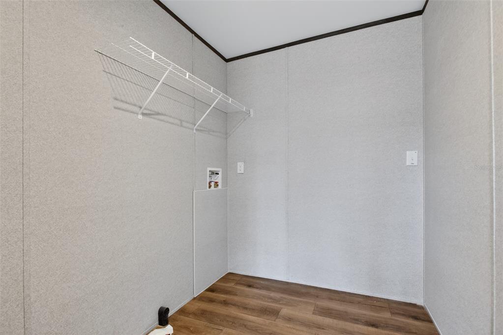 419 Lily Trail Interlachen, FL 32148 - Photo 23 of 78 a view of a room with racks on the wall